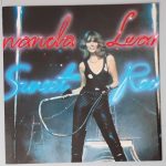 Amanda Lear – "Sweet Revenge" (Ariola – 25 900 XOT) Colour Poster Amanda Lear – "Sweet Revenge" (Ariola – 25 900 XOT) Colour Poster